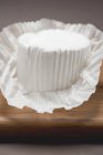 Goat's cheese on wooden desk — Stock Photo