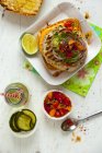 Top view of chicken burger with relish and a drink — Stock Photo