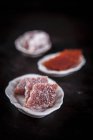Quince bread rolled into sugar, pure and with coconut chips in the background — Stock Photo