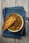 Onion and vegetable soup with toasted cheese sourdough bread — Stock Photo