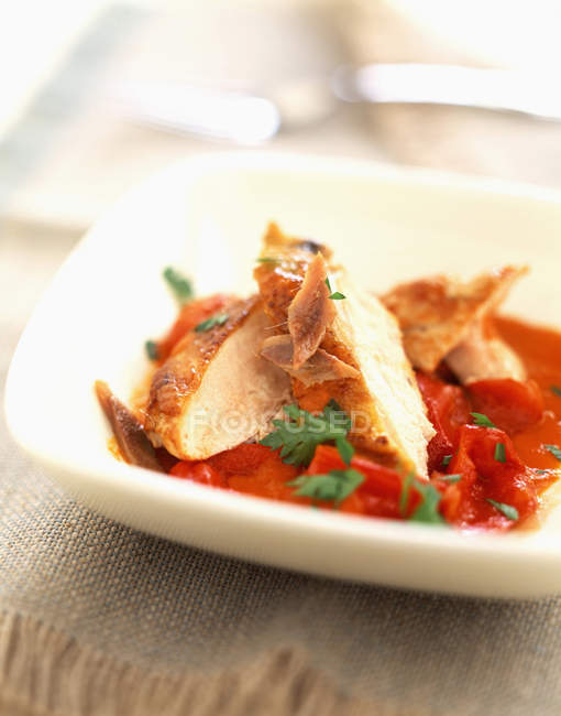 Thinly sliced chicken on plate — Stock Photo