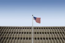 American Flag In Front Of  Building — Stock Photo