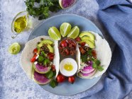 Top view plate of veggie tacos with sauce on marble table — Stock Photo