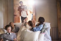 Group of teenagers waiting for pizza in living room — Stock Photo
