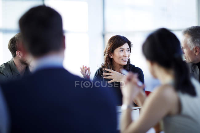 Successful adult business people talking in meeting — Stock Photo