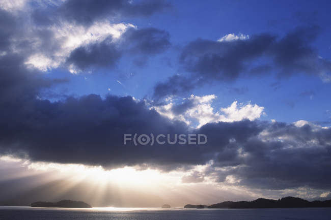 Sunshine through clouds near Prince Rupert, Central Coast along Inside Passage, British Columbia, Canada. — Stock Photo