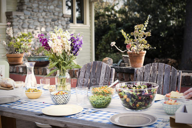 Table set for a meal outdoors — Stock Photo