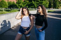 Trendy confident girls on street — Stock Photo
