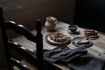 Lentil pate on plate on rustic wooden table — Stock Photo