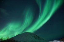 Spectacular green and pink Northern Lights in Tromso — Stock Photo