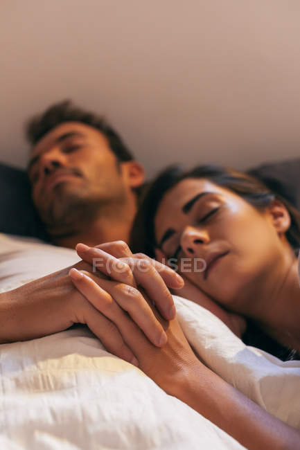 Young Couple Sleeping in Bed — Stock Photo