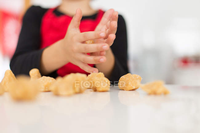 Close-up of Boy making cookies in kitchen — Stock Photo
