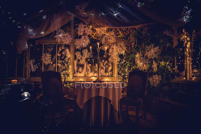 Candlestick on a table in conservatory at Christmas — Stock Photo