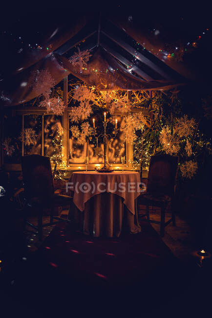 Candlestick on a table in conservatory at Christmas — Stock Photo